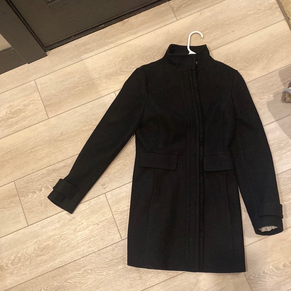 Banana republic black coat with Detail down the zipper. Button at top
